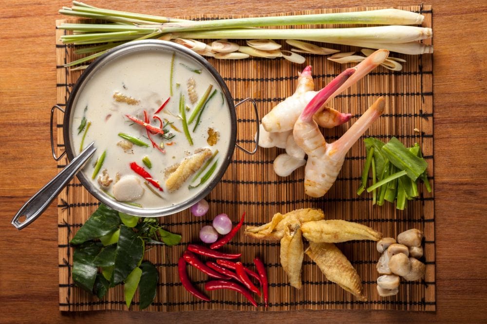 Tom kha gai, a Thai coconut milk and herb soup made with chicken, galangal, lemongrass, and Thai chili peppers.