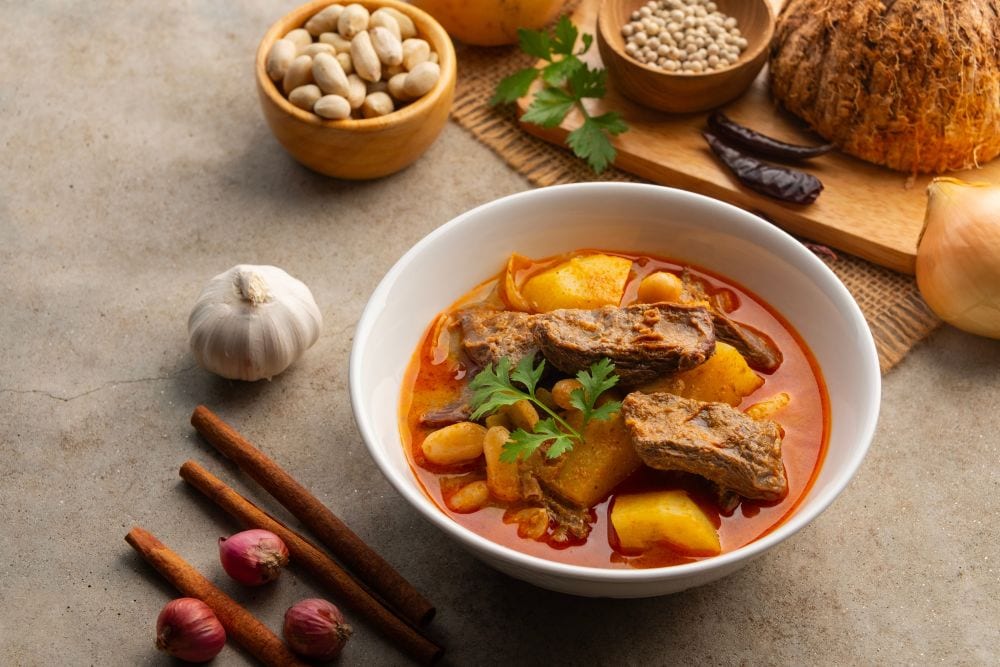 Massaman curry prepared with a rich selection of Thai spices and traditional Thai ingredients.